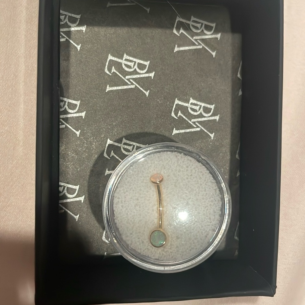 BVLA solid 18 karat gold 14g 7/16 navel curve with 3.0 and 5.0 AA white opal.
